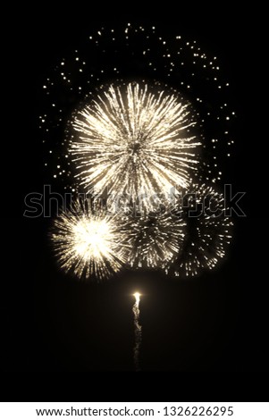 High-quality image of beautiful golden fireworks with trail isolated on the black background for overlay design of celebration new year or festivals