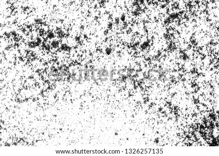Black dust on a white background, abstract. Monochrome texture.