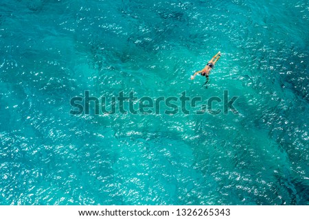 Aerial photo of a long distance swimmer in turquoise waters of the Mediterranean Sea