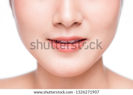 Young asian woman close up. Perfect natural lip makeup