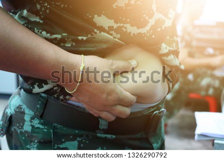 The female soldiers took their hands on the belly because they were fat.