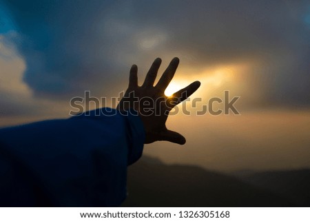 Hands, sun shields and beautiful sky scenes