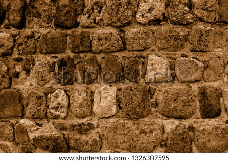 Ancient dark walls. Wallpaper and background for modern design. Medieval masonry. Stonework