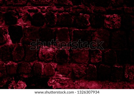 Red ancient stonework in the night