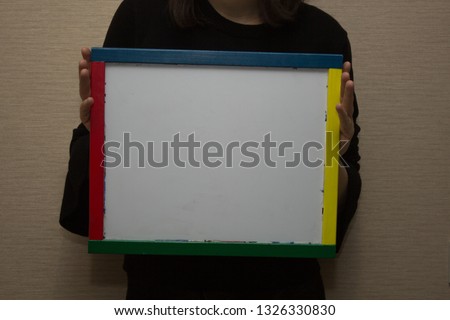 white markers board, light background,, woman hold  board, mock up, horizontal