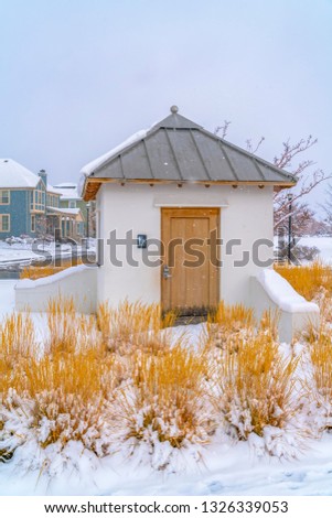 Womens Restroom against snowy grasses and homes