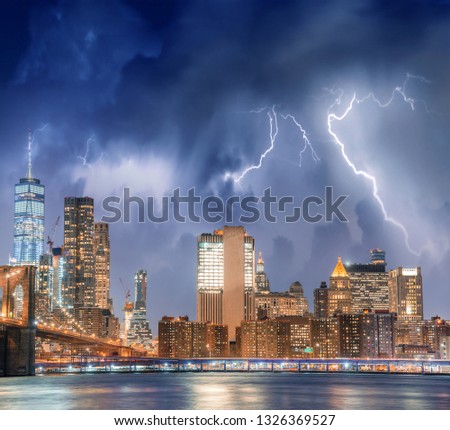 New York City with thunderstorm approaching - Manhattan skyline.