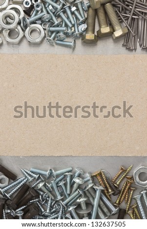 metal construction  hardware tool and wrapped paper