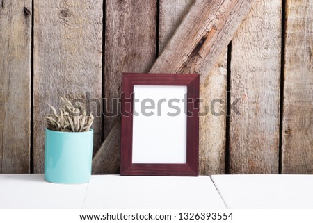 brown picture frame, wooden background