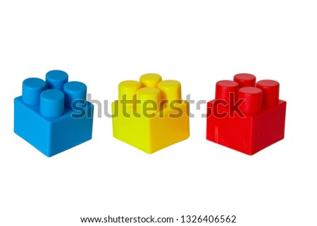 pictured in the photo Wall from Plastic building blocks isolated on white background.