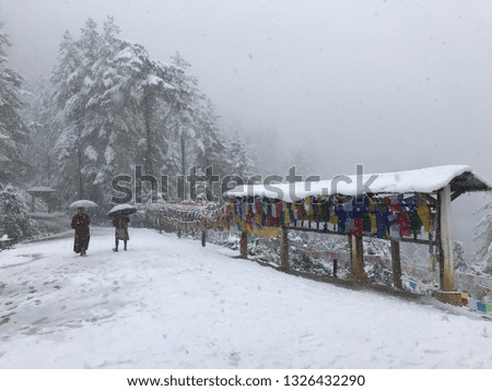 Trekking while snowing up to the hill In Bhutan