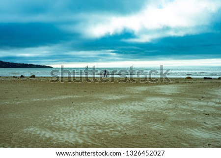  Sandy  Beach,   with couple of stones on the sand and other artifacts. relaxing scenery horizon perfect holidays.