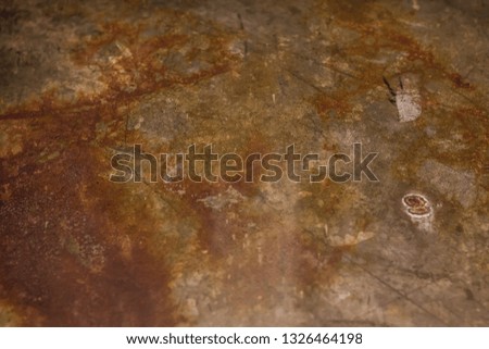 Old rusted iron plates on the floor , soft focus , blurred.