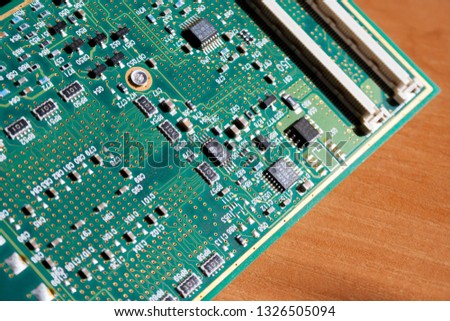 Close-up picture of green printed circuit board - PCB. Computer curcuit background.