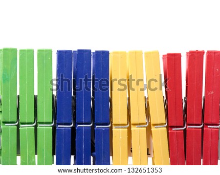 Set of plastic clothes pins colorful on white background