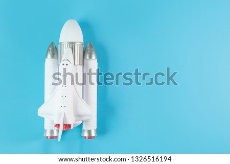 close up image space ship on blue background.