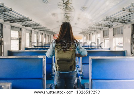 woman travel backpack by train .
