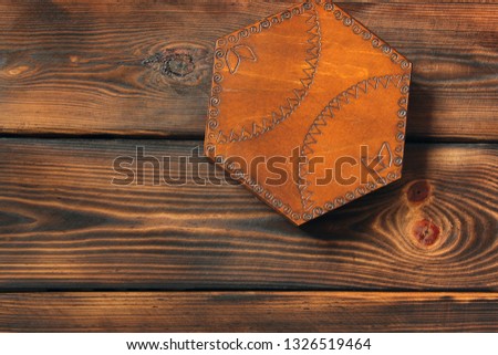 Casket on wooden background. Wooden box