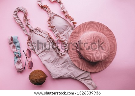 Swimsuit on pink background isolated