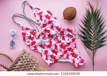 Swimsuit on pink background isolated