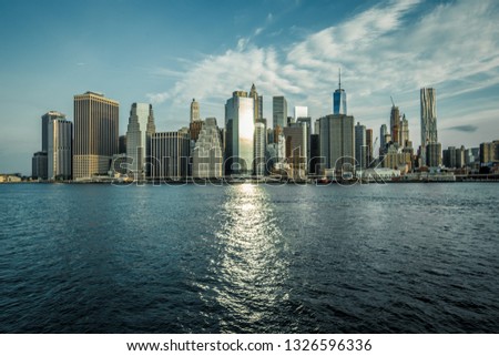 Downtown Manhattan view from Brooklyn Bridge Park - NYC Skyline and wood pylons 