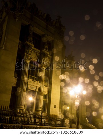 Haunted estate with yellow bokeh ligth at night in the fog mist