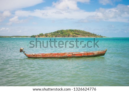 Small boat at Pontal da Ilha beach, at the north tip of Itamaraca island (Pernambuco, Brazil)