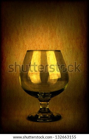 Vintage and Toned Photo of the Glass on Dark Brown Background
