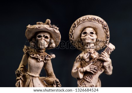 Creepy bone carved Mexican wedding cake toppers for alternative wedding 