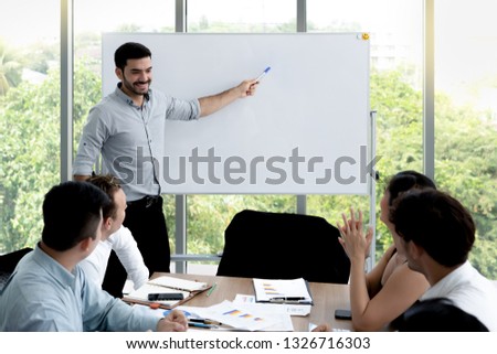 Business people explaining or presenting something an empty white board