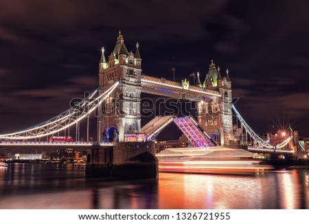 Bascule bridge at Night. Long exposure light of boat when it passes through  bridge. Long exposure photography. London. Great Britain.