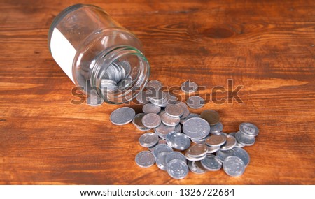 glass jar and coins