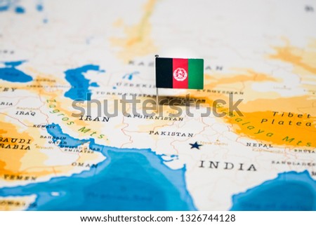 the Flag of afghanistan in the world map Royalty-Free Stock Photo #1326744128