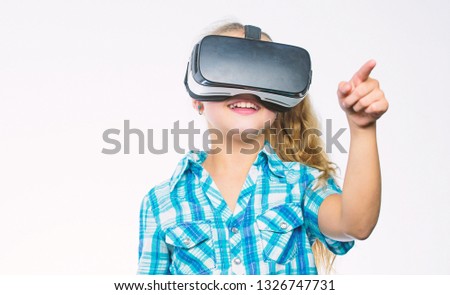Girl cute child with head mounted display on white background. Virtual education for school pupil. Get virtual experience. Virtual reality concept. Kid explore modern technology virtual reality.
