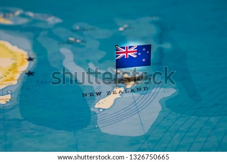 the Flag of new zealand in the world map Royalty-Free Stock Photo #1326750665