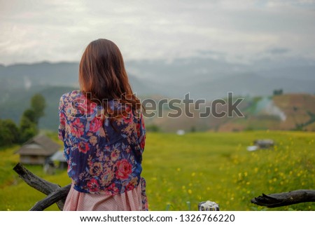 woman feeling lonely near rice field on mountain