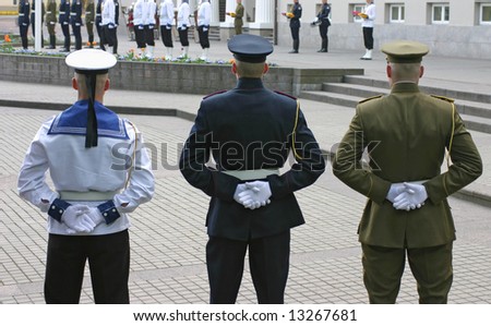Three soldiers stand guard at lithuanian national flag ceremony Royalty-Free Stock Photo #13267681