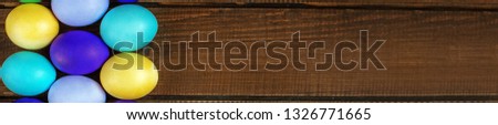 Many eggs on wooden background. Banner for the site. Concept and happy Easter holiday.