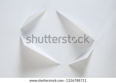 folded sheet of paper on white background. An idea for your minimalist design