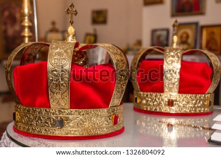 Wedding golden crowns ready for wedding ceremony in Serbian orthodox church. Royalty-Free Stock Photo #1326804092