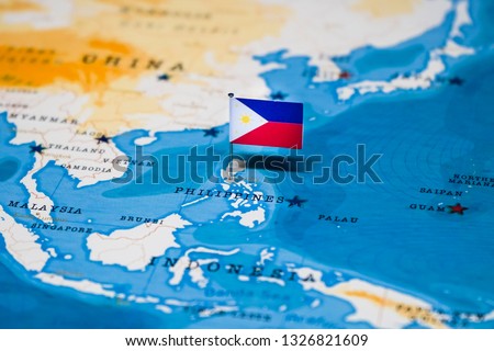 the Flag of philippines in the world map Royalty-Free Stock Photo #1326821609