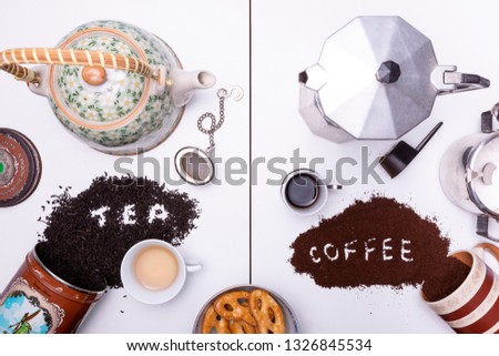 Divided frame with on the left a teapot and tea, on the right a moka pot and coffee. Studio shot with the written words 'tea' in tea leafs and 'coffee' in coffee grain with cookies in the middle below
