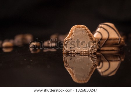 candies
chocolate filled (cream filling). food background. top view