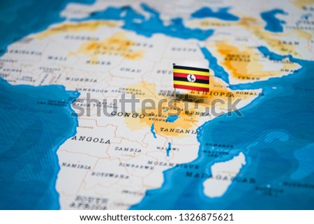 the Flag of uganda in the world map Royalty-Free Stock Photo #1326875621