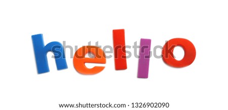 Word HELLO of magnetic letters on white background, top view