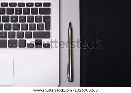 laptop on desck with pen and map for business 