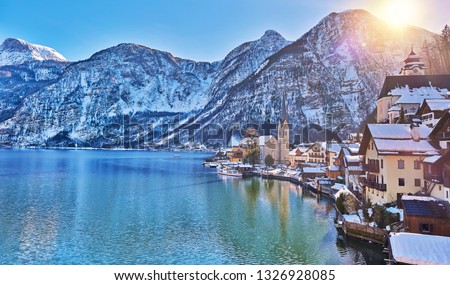 Beautiful winter landscape of Hallstatt mountain village with Hallstatter lake in Austrian Alps. Wide Panorama