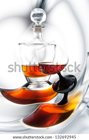 cognac or whiskey in a bottle and glass