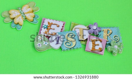 Easter banner with a butterfly laying flat on a green background
