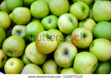  apple symbols of sweet and sour taste, Fresh green apples on the counter, Bunch of green juicy green apples, background of green apples on sale at the local market